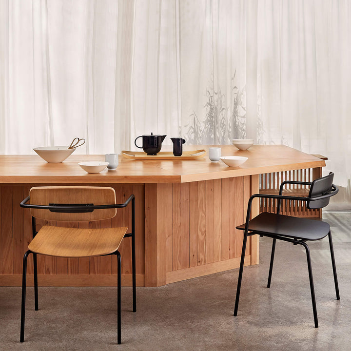 Set of two dining chairs with open back in a restaurant