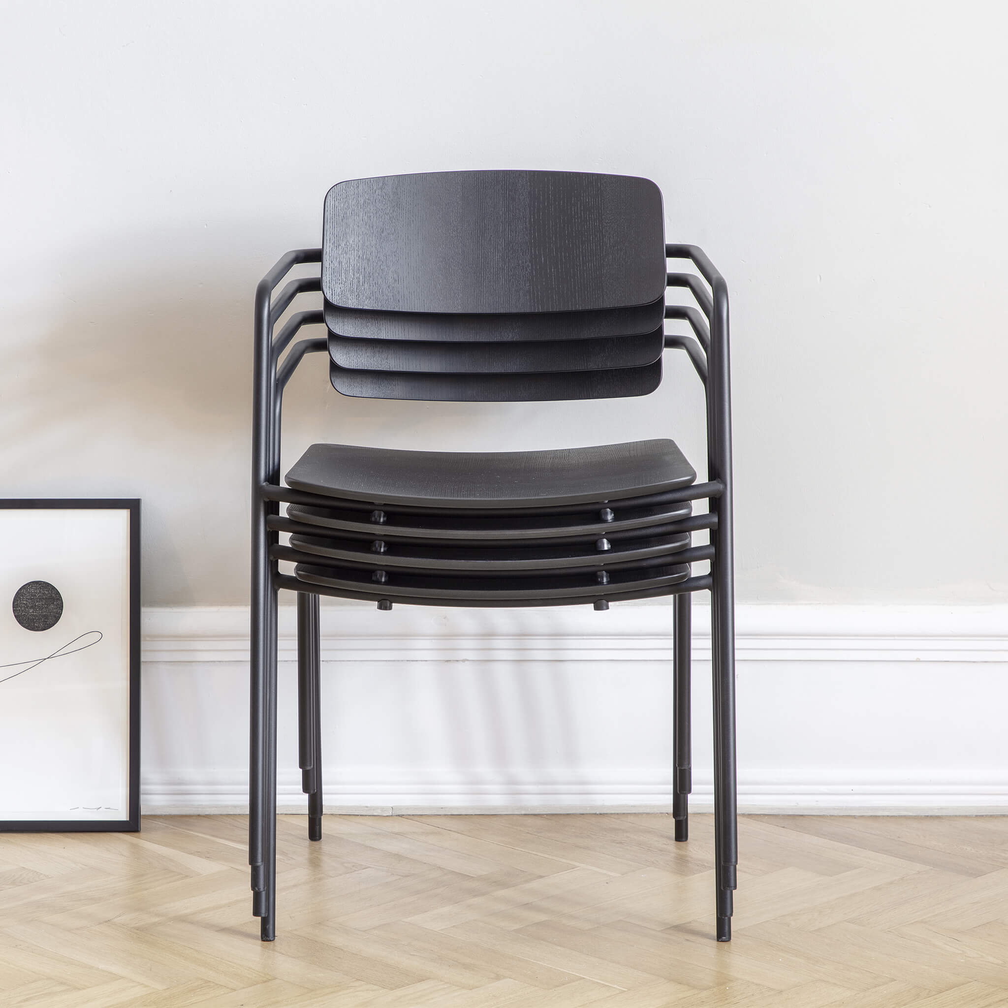 Set of four dining chair stacked on top of each other