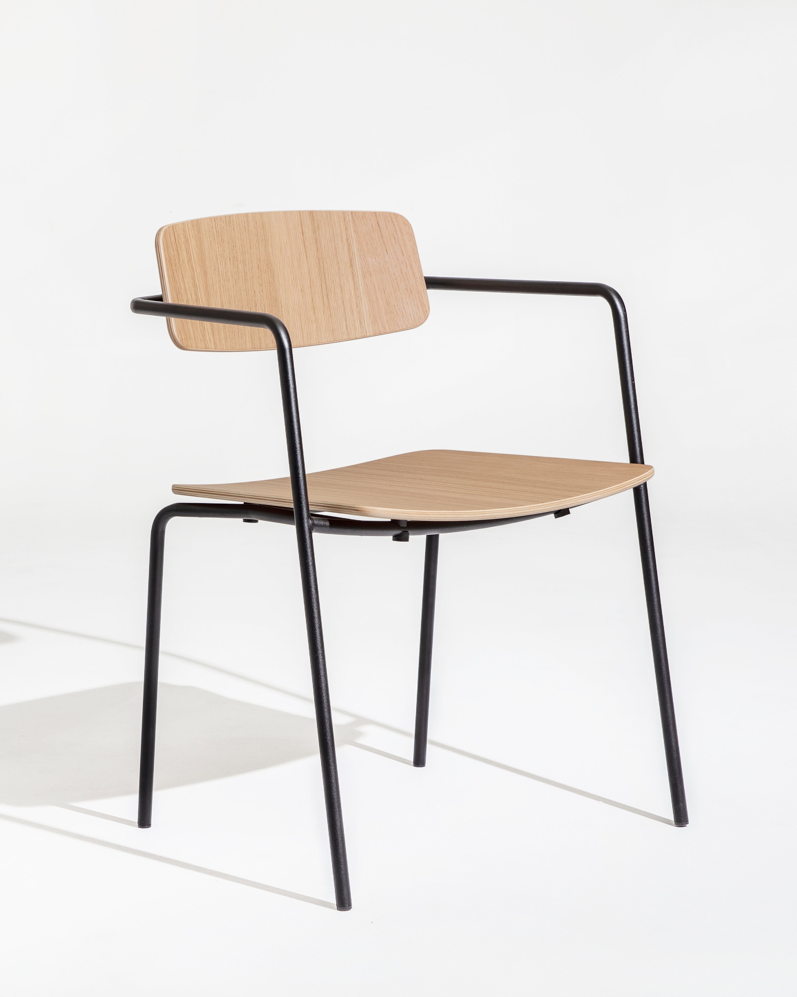 Float chair in natural oak veneer with black steel frame, full silhouette on white background by Motarasu