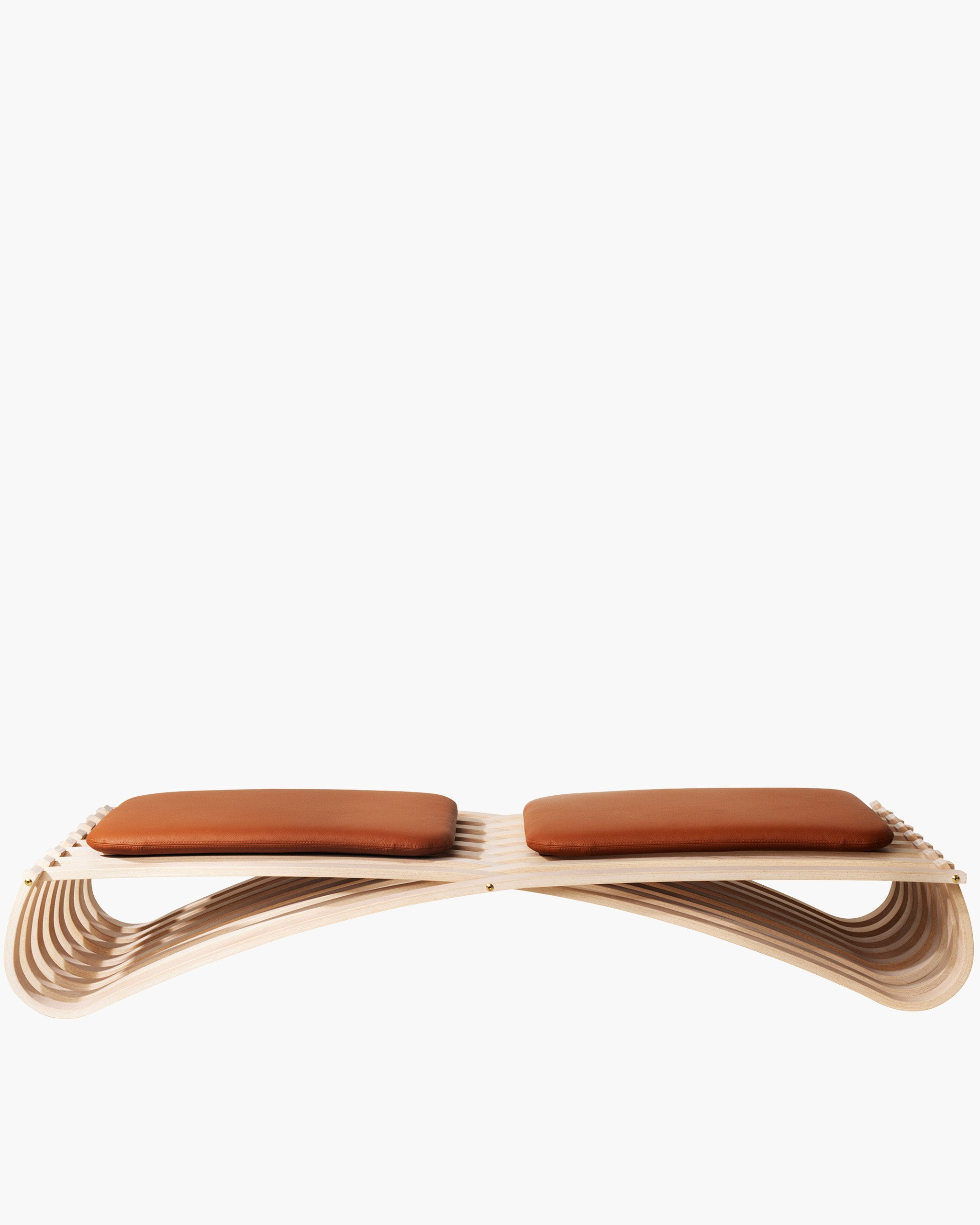 A modern curved wooden bench with two brown leather seat cushions, shown against a plain white background.