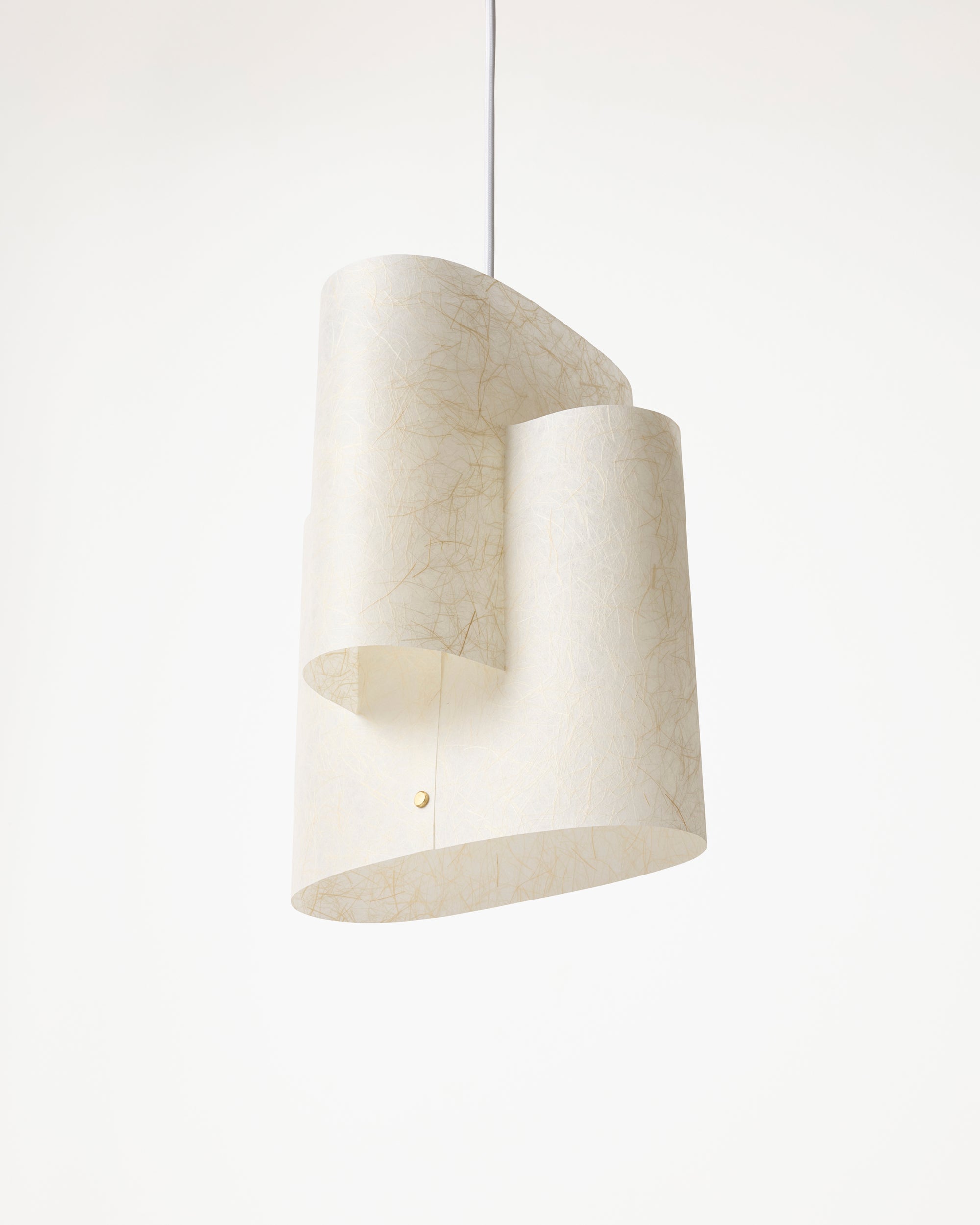 Sekiun Raw pendant light seen at an angle, showing the offset oval washi shadessoft minimalism