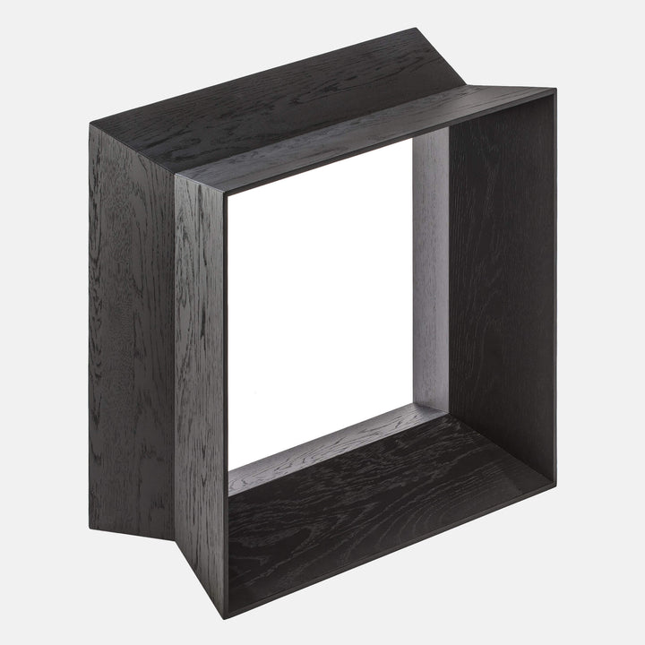 Close up of a black oak stool, side view