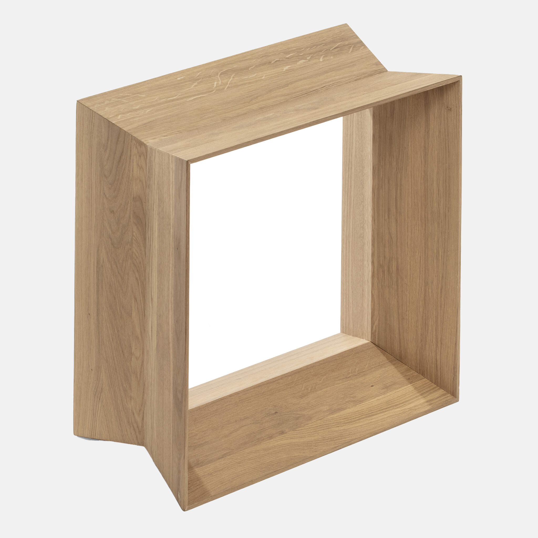 Close up of a light brown oak stool, side view