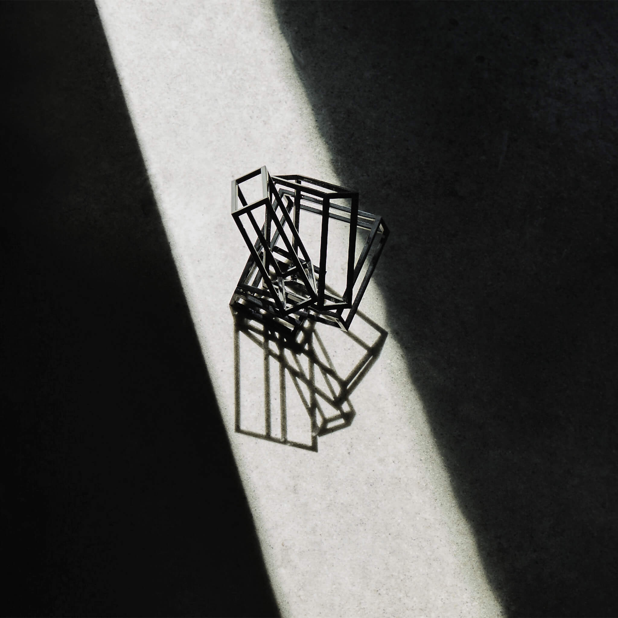 Ray of light casting over the steel sculpture
