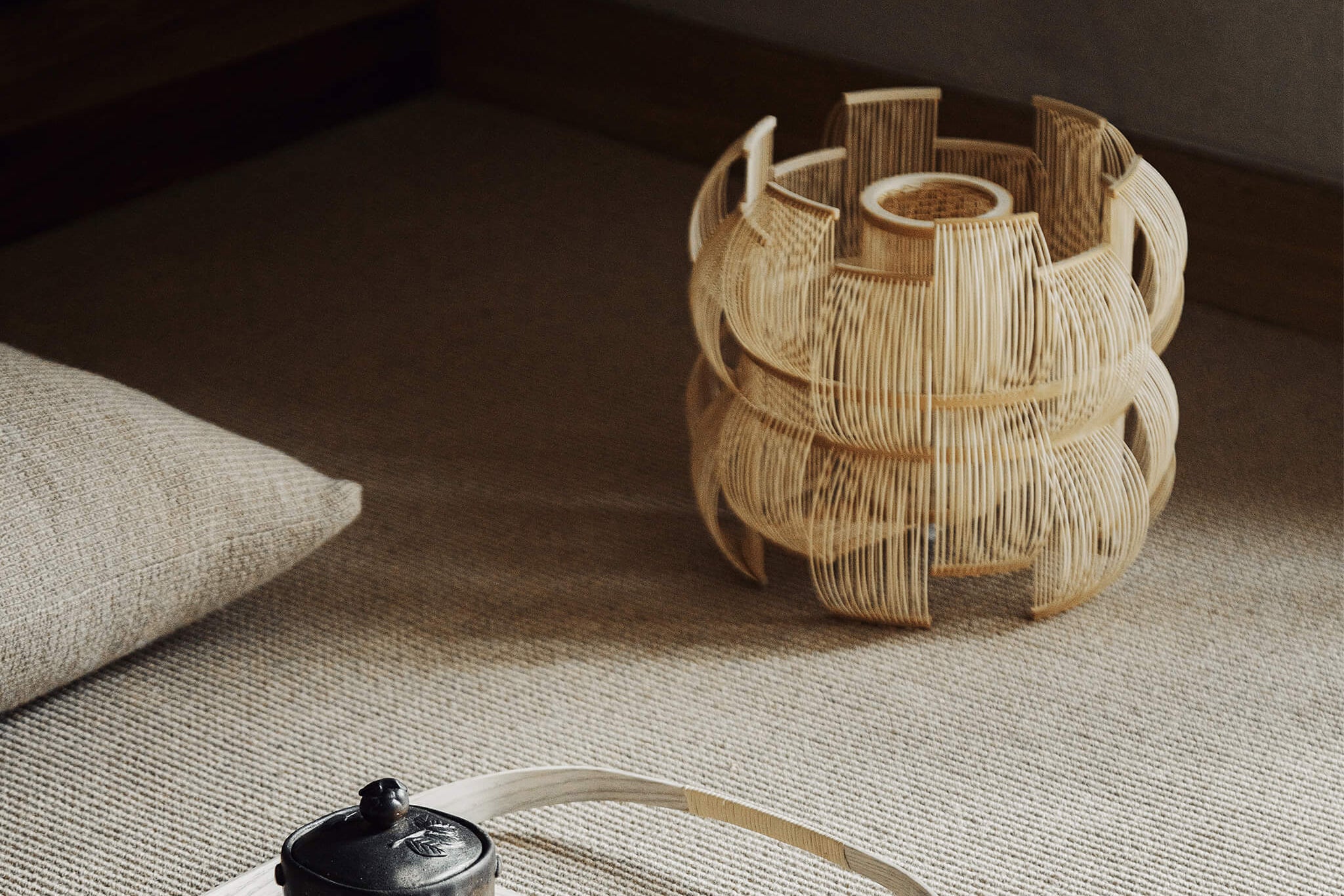 Bamboo table lamp next to a tray and tea set