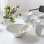 Set of porcelain bowls placed on a dining table