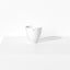 Small porcelain bowl featuring a design with one blue indigo dot