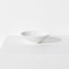Small porcelain bowl featuring a design with three blue indigo dots