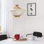 Four tea mugs and a teapot placed on a dining table