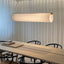 Pendant light in a meeting room, placed above the table
