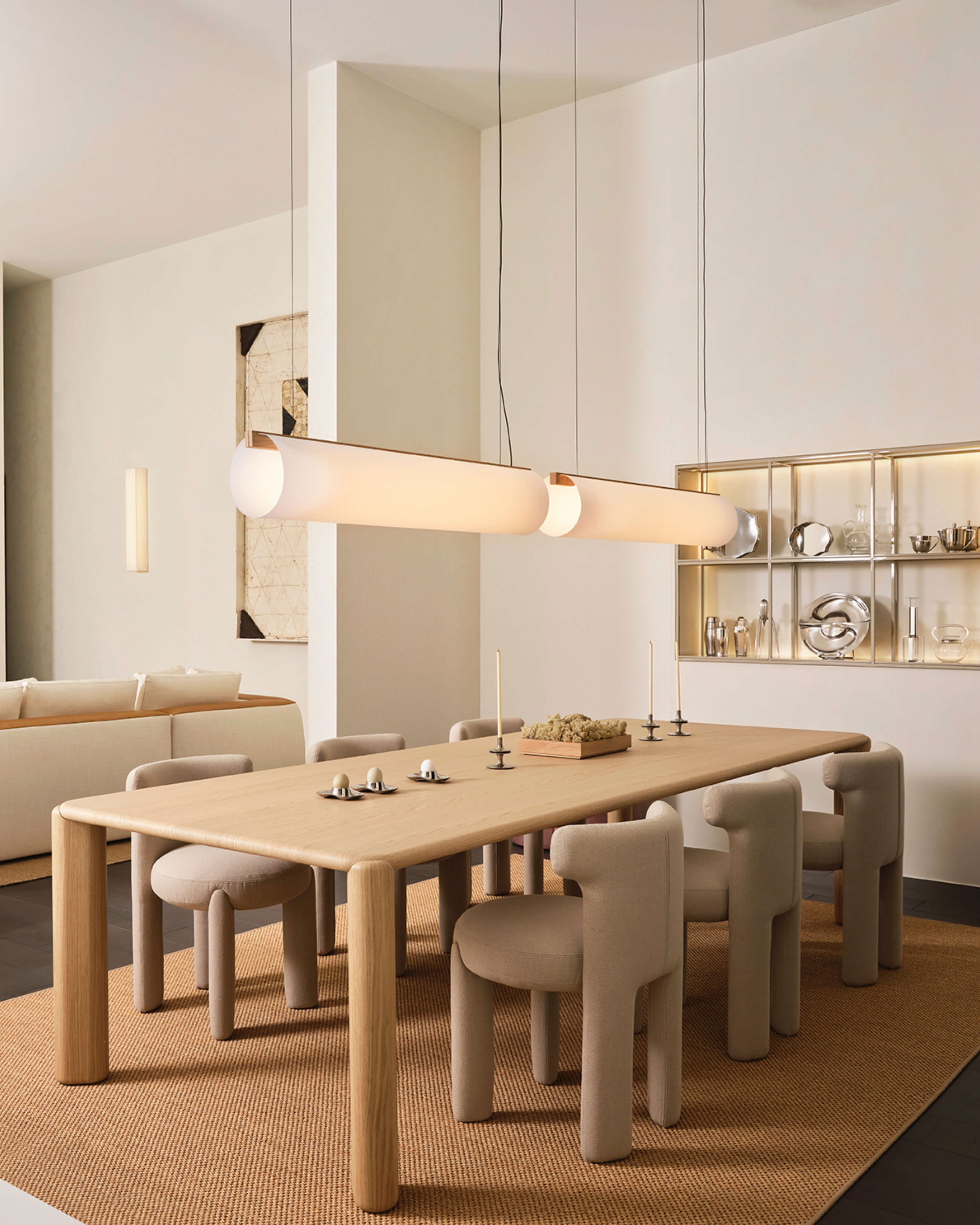 Two Enso 120 Pendants in washi paper and oak, styled in a large dining interior above table by Motarasu