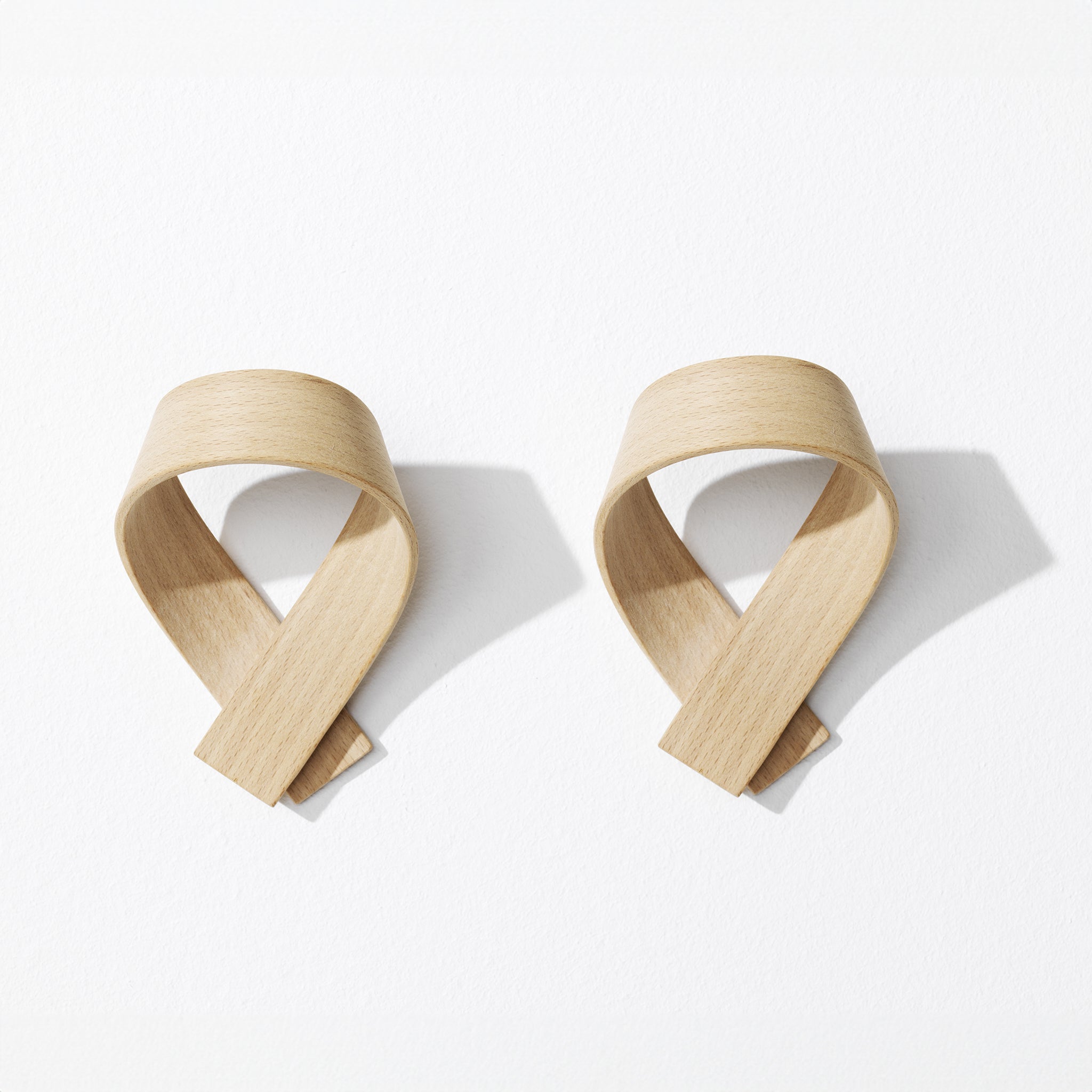 Set of two light brown wooden coat hooks