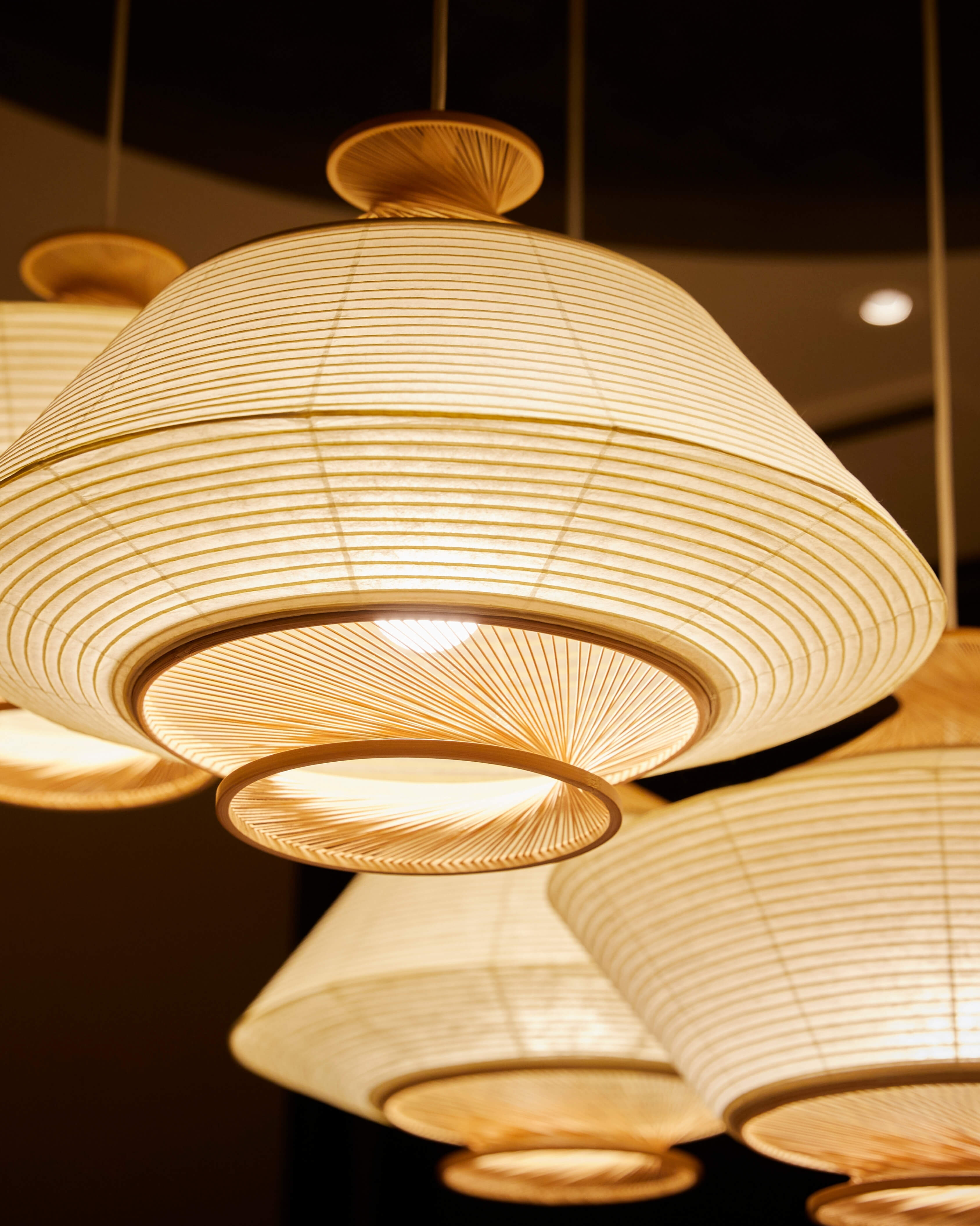 Ron pendants in washi paper and Hiba wood, styled together in a warm residential interior by Motarasu