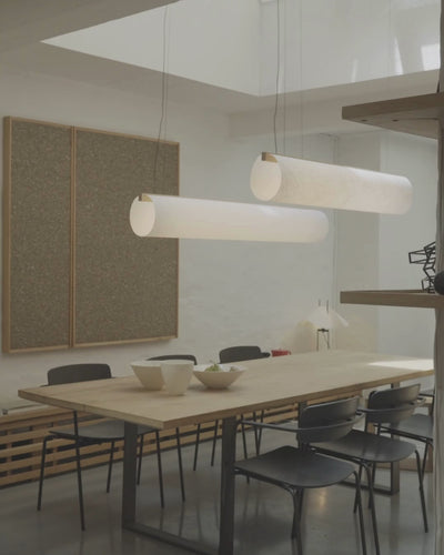 Enso Pendants in washi paper and oak, styled above a dining table in calm interior by Motarasu